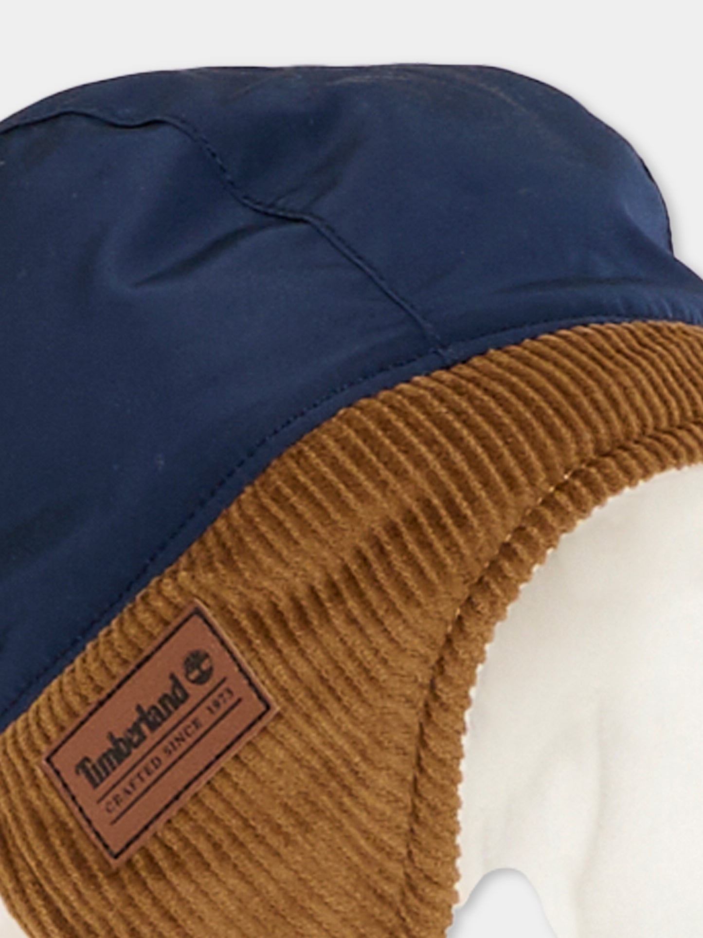 Cappello blu con paraorecchie per neonato