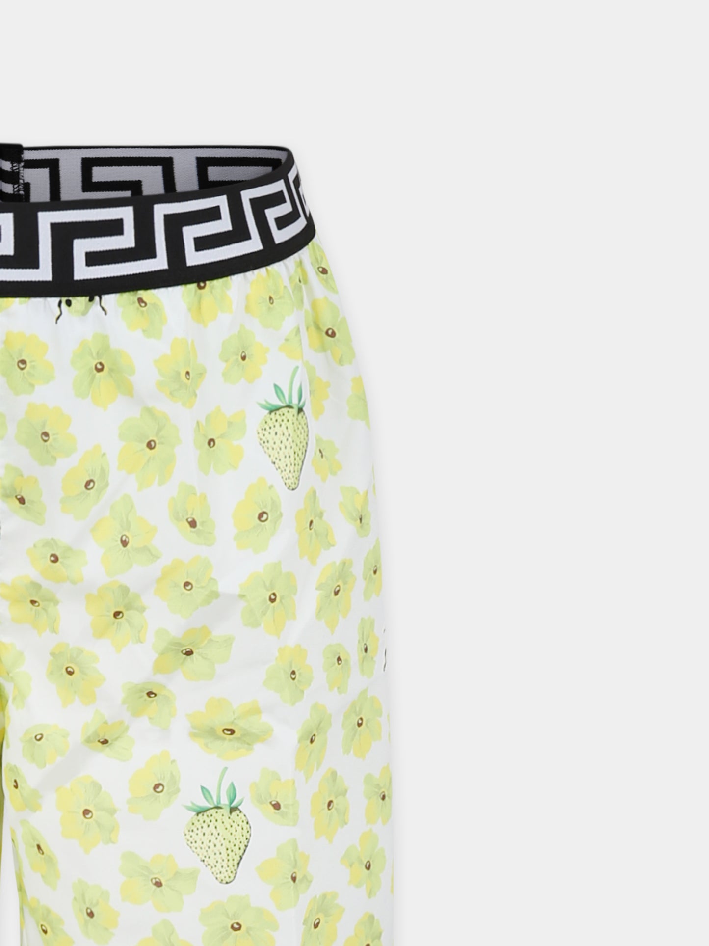 Yellow swim shorts for boy with floral print